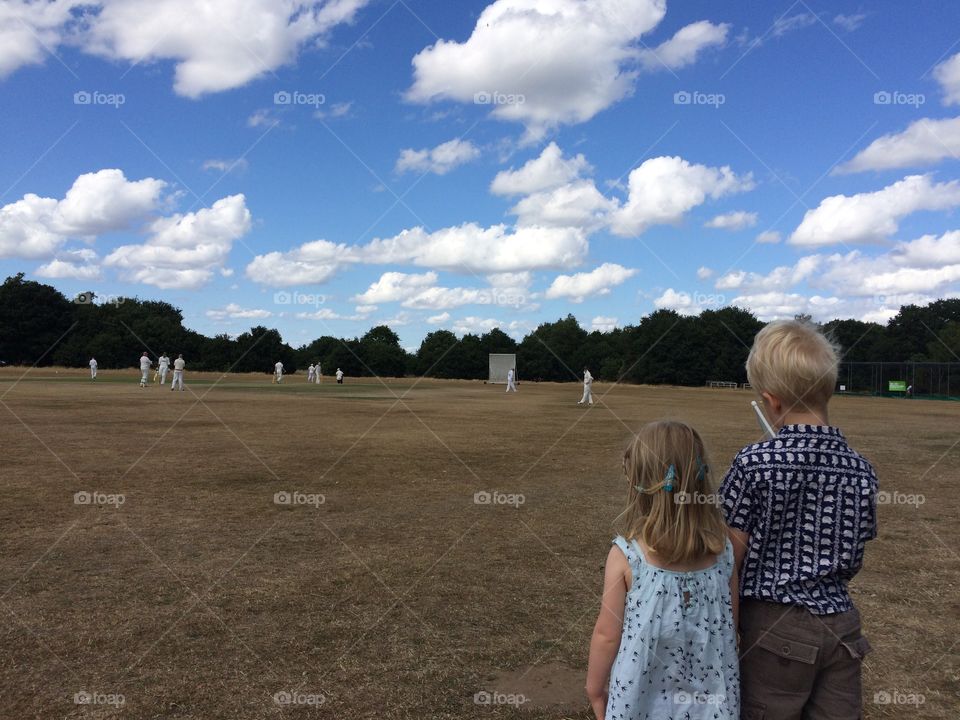 Watching cricket. Village cricket match, Ripley, Surrey, England