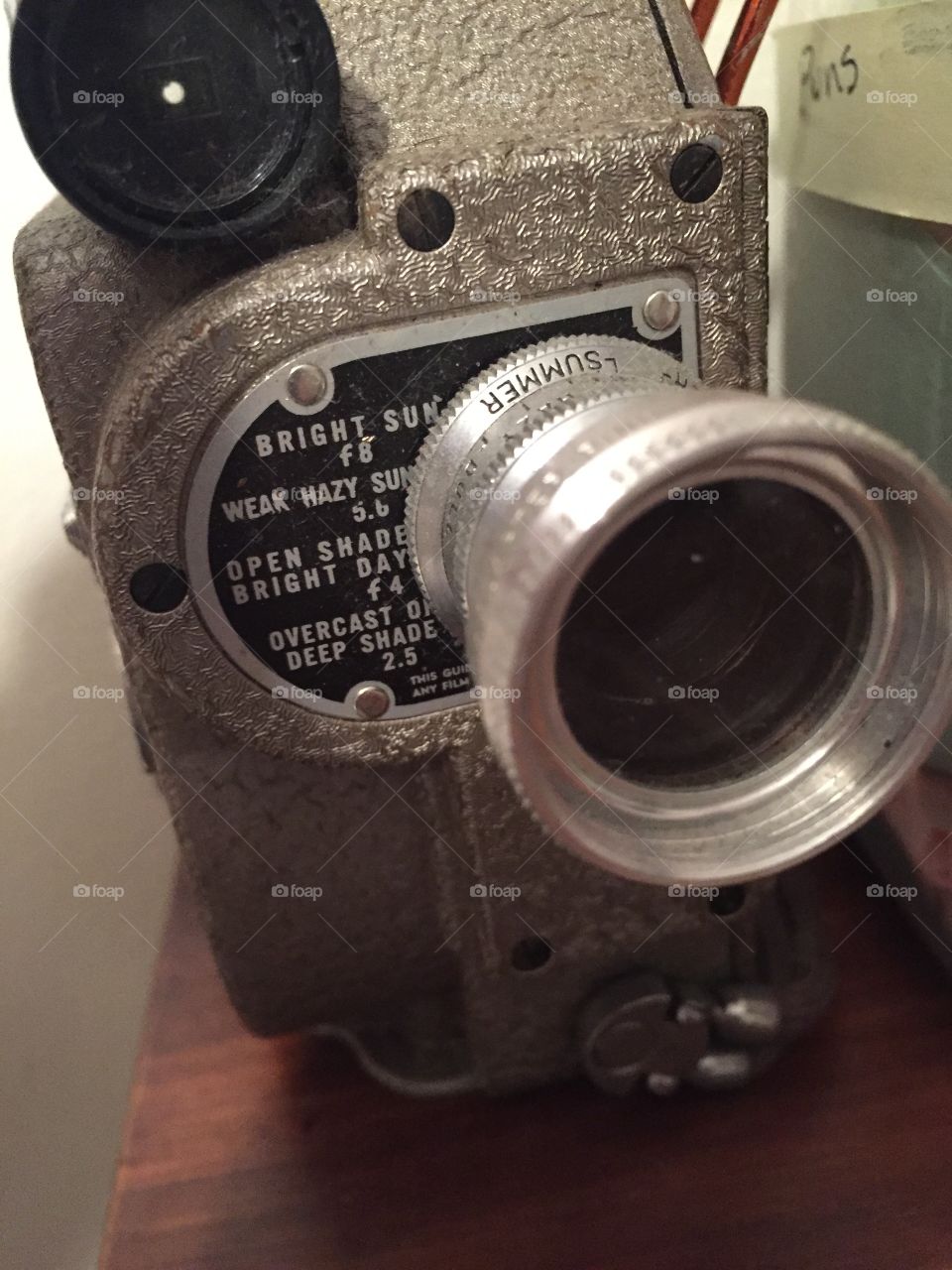 Very old vintage camera  in collection of cameras and movie paraphalia. 