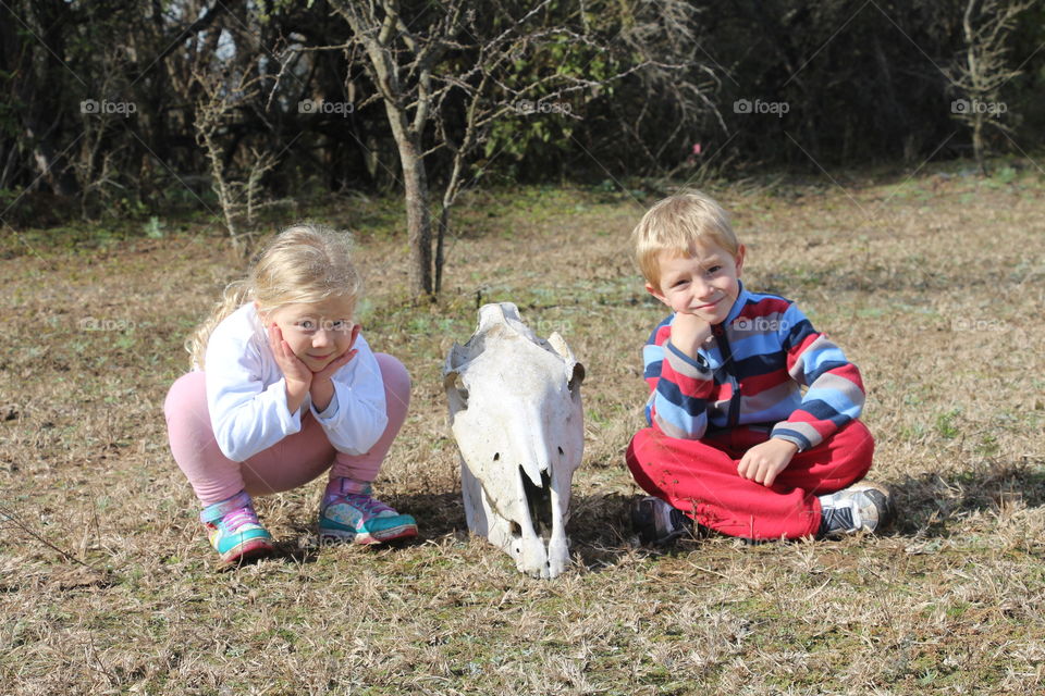 children playing with animal bones