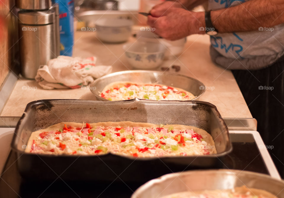 Man Prepares And Cooking Pizza At Home
