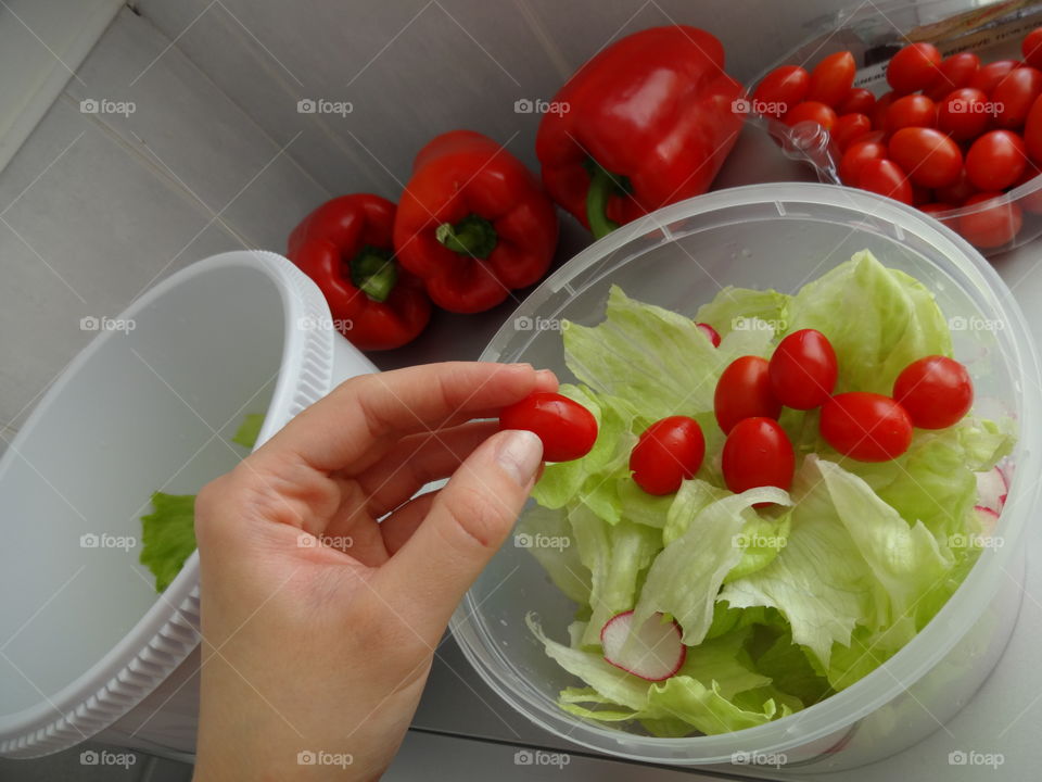 Healthy breakfast- salad with fresh lettuce,  paprica and cherry tomato