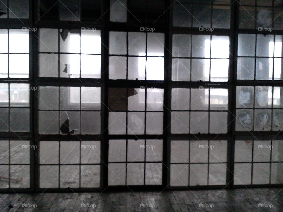 Through the Glass. Glass panes in an abandoned venue.
