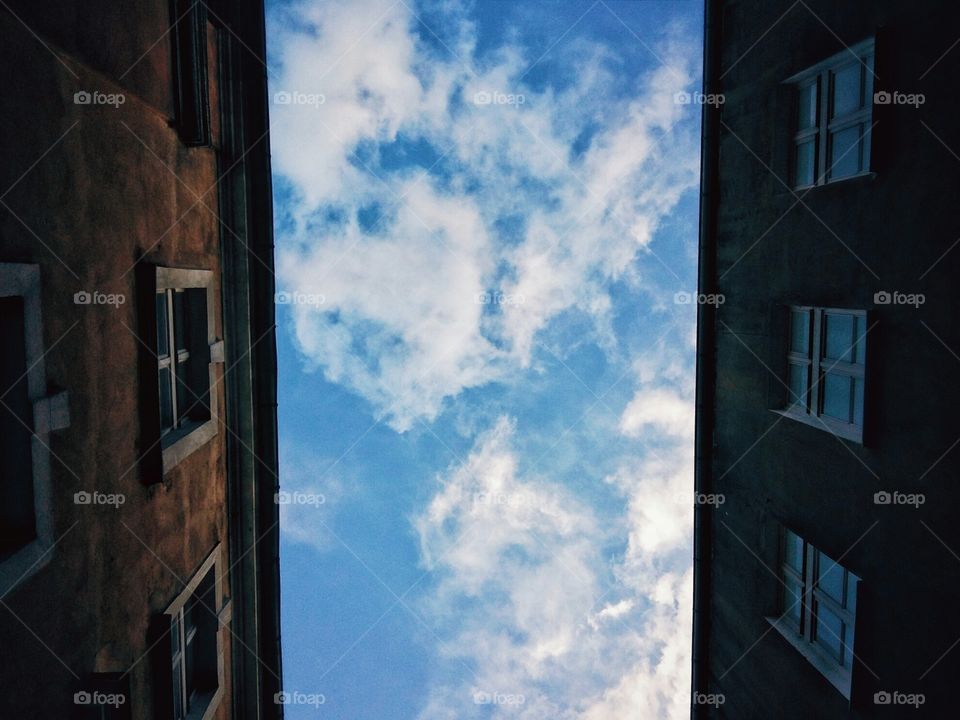 Looking up at Blue Sky and clouds from the  its setting.