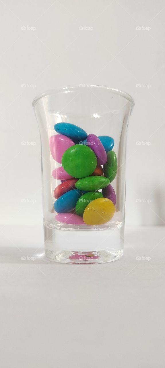 glass fill with colorful candies