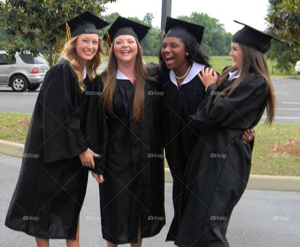 Group of happy female graduate students