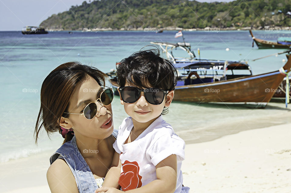 Portrait of mother and son on the beach at Koh Lipe Satun , Thailand