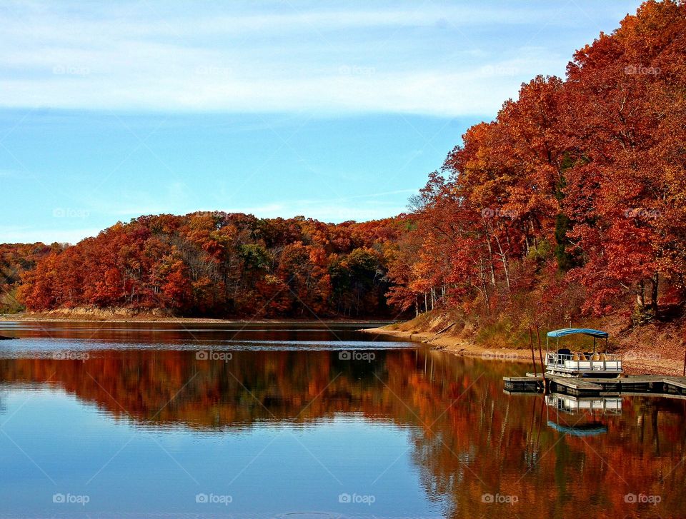 Autumn trees reflecting on lake