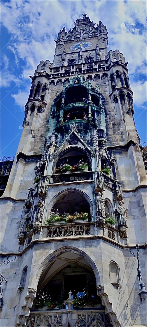 This is a closeup view of one of the gothic towers of the „Rathaus“ in „Munich“, capitol of „Bavaria“. The landmark building houses city hall and dates back to the „Middle Ages“. It was renovated and rebuilt in the 1800s. 2023. Hypnotic Productions