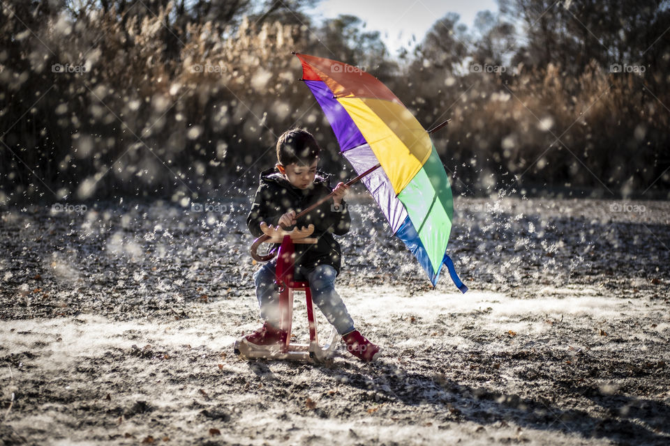 Boy holding an umbrella