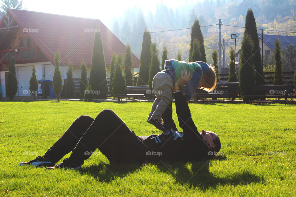 Father and son playing