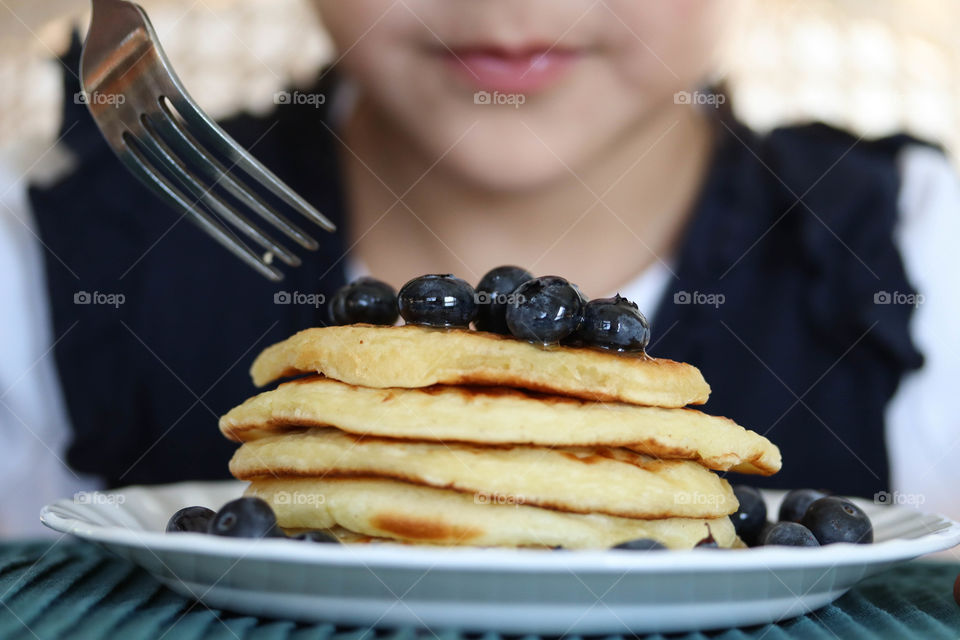 Eating pancakes