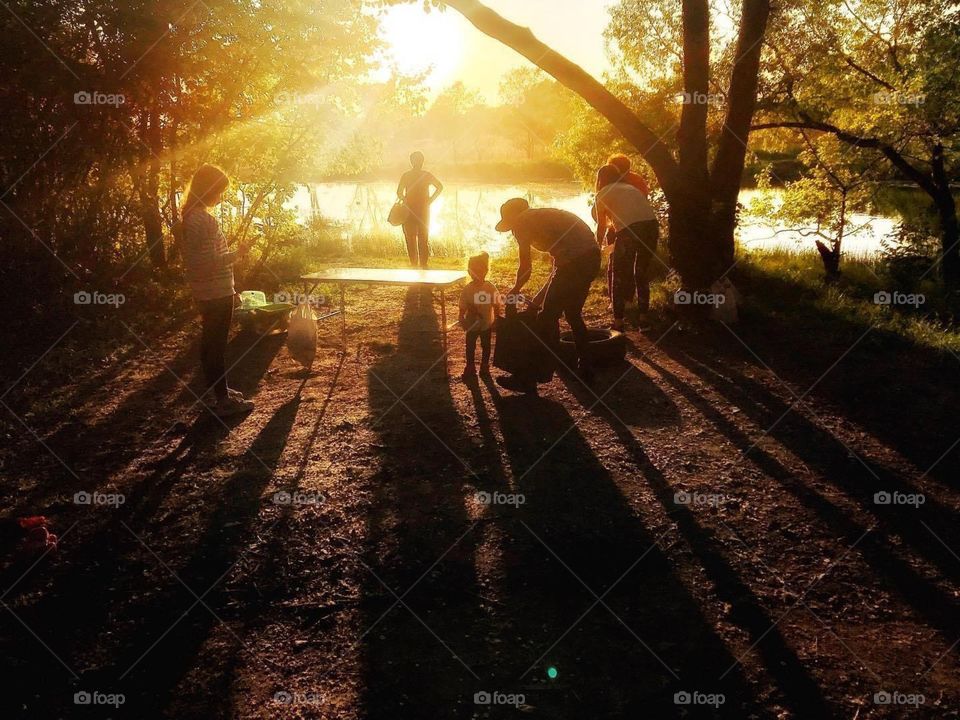 golden hour, people in the rays of sunset, family in nature at sunset, lake in the rays of sunset