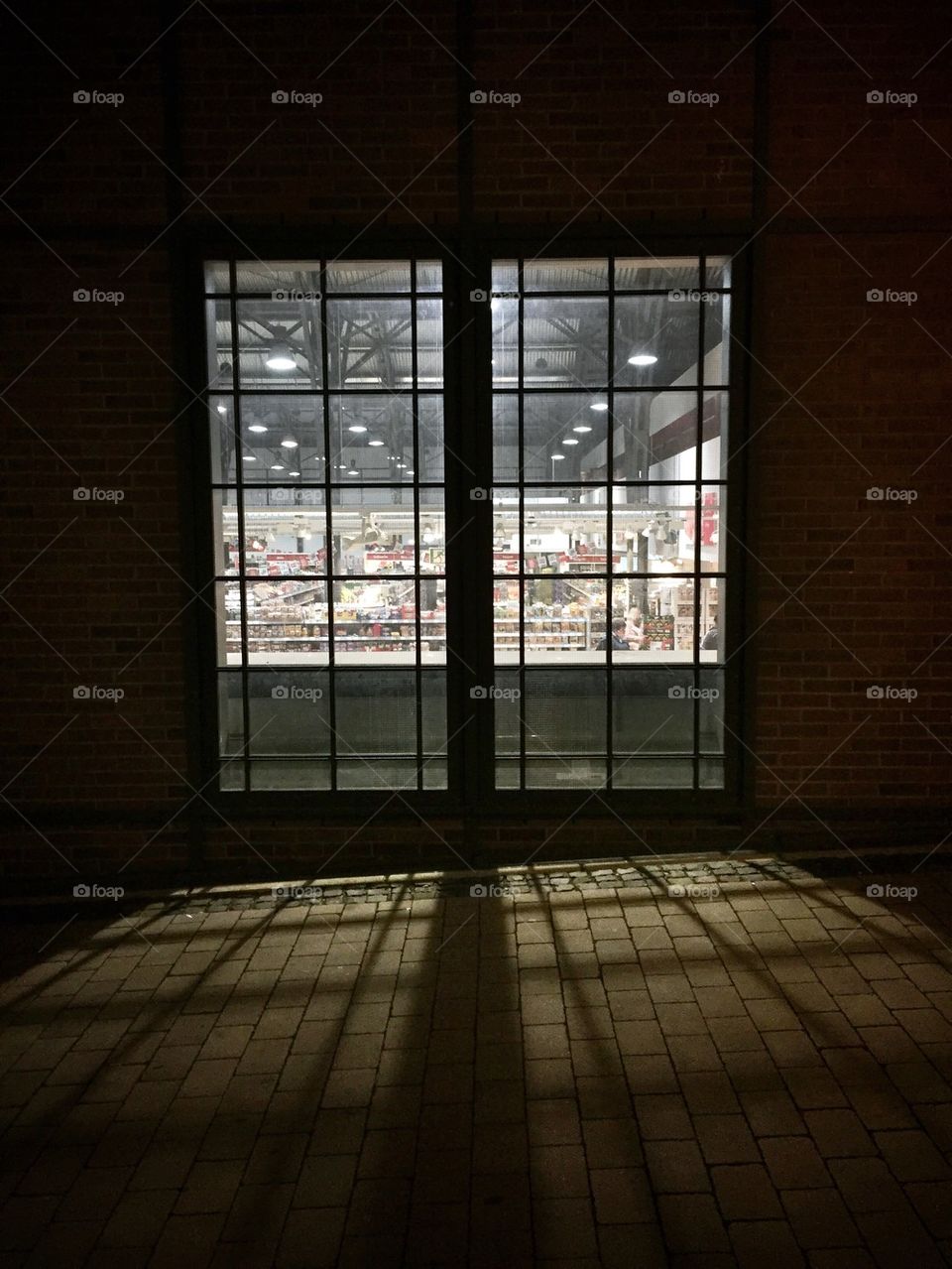 Supermarket window at night