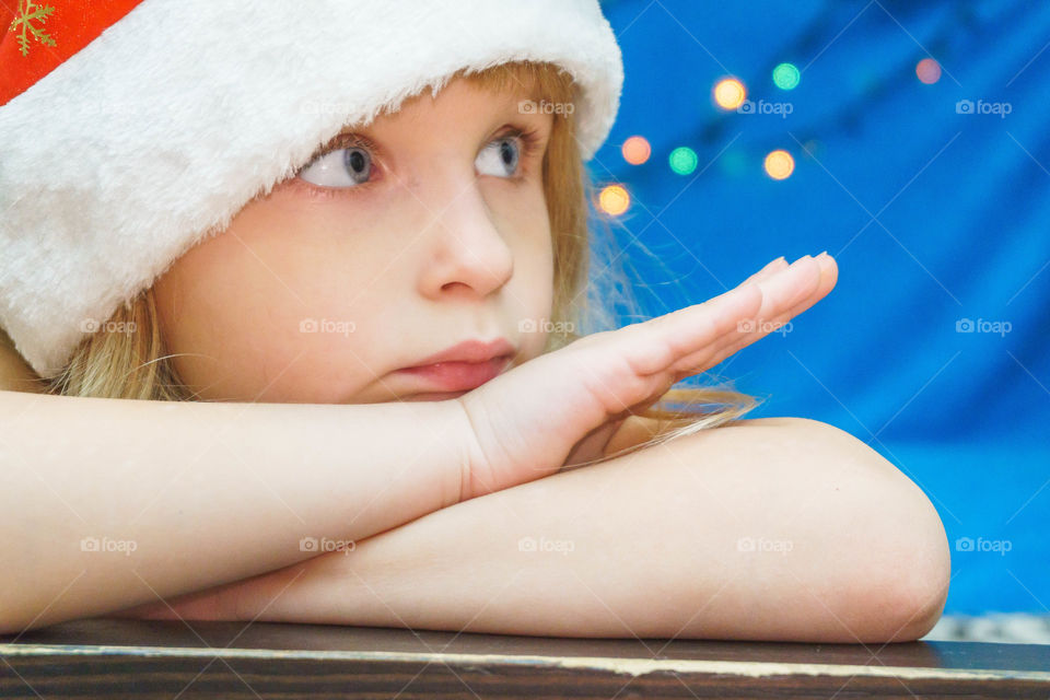 little girl in Santa hat