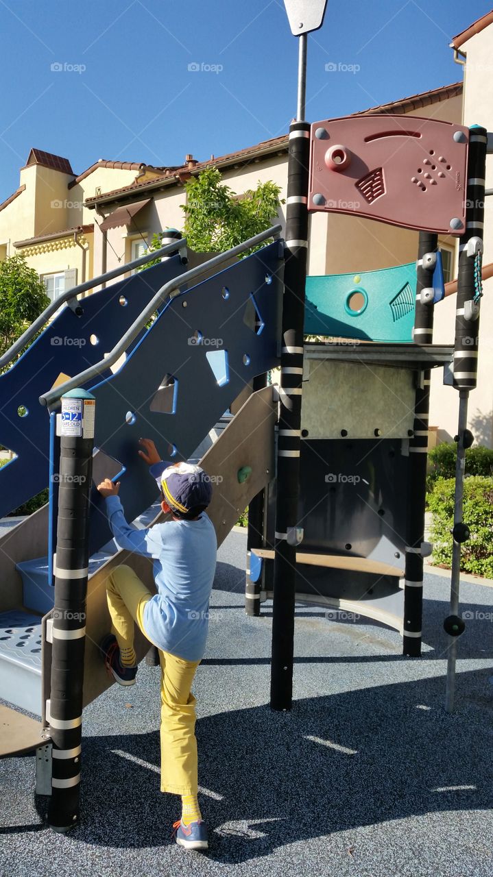 Kid playing on a slide