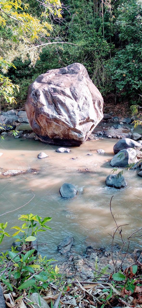 This big rock is in the middle of the river