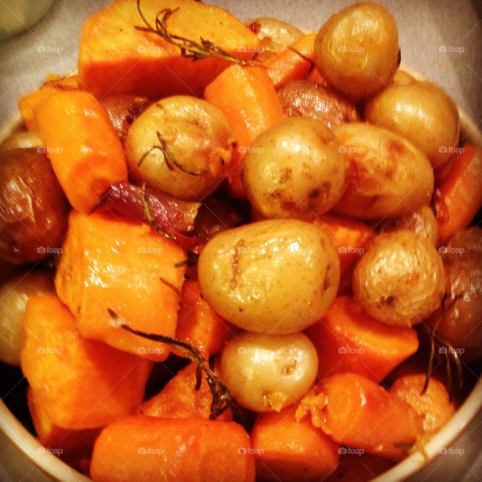 Roast baby potatoes, yams, carrots, shallots and garlic with fresh rosemary from the garden! Love Thanksgiving!